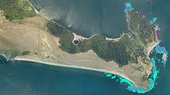 Aerial photo of a cove on the San Juan islands with bright blue data points highlighting the cove edge
