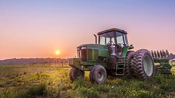 A green tractor in a field