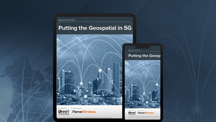 Image of a city with a blue and patterned graphic of a hand holding a cell phone superimposed over top