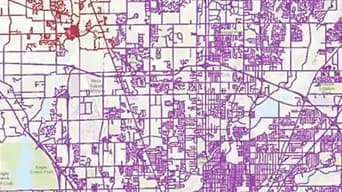 A gridded map outlined in purple and red