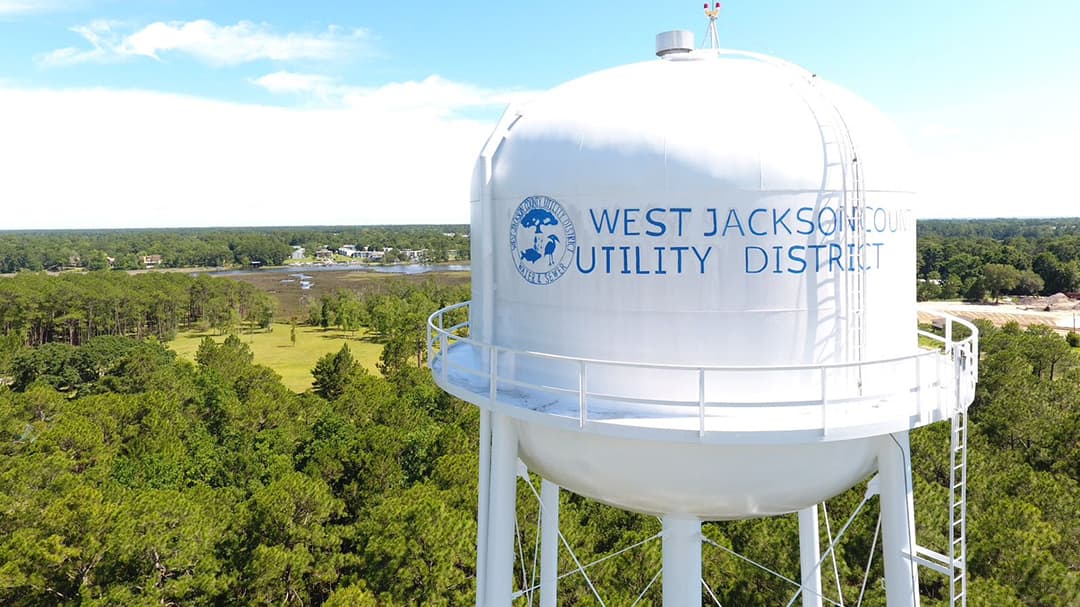 Satellite image of a city grid with blue and yellow lines indicating water systems