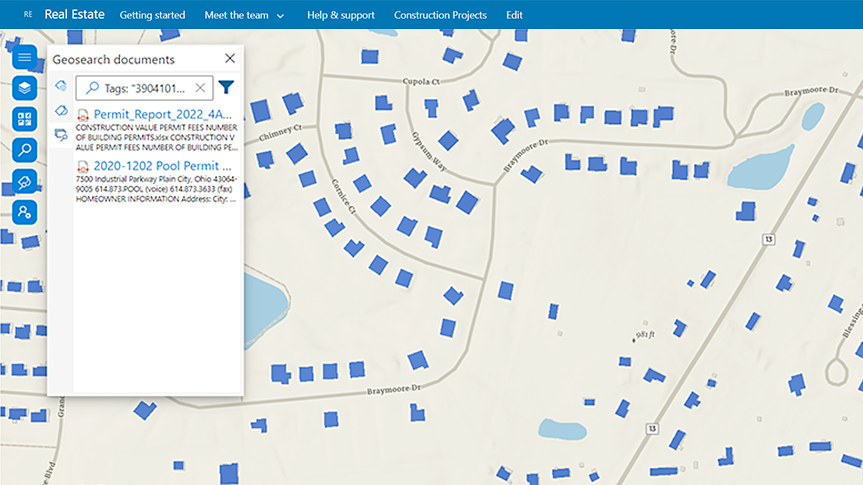 A Microsoft SharePoint interface displaying a map of a neighborhood with structures highlighted in blue and a search pane overlaid to the left 