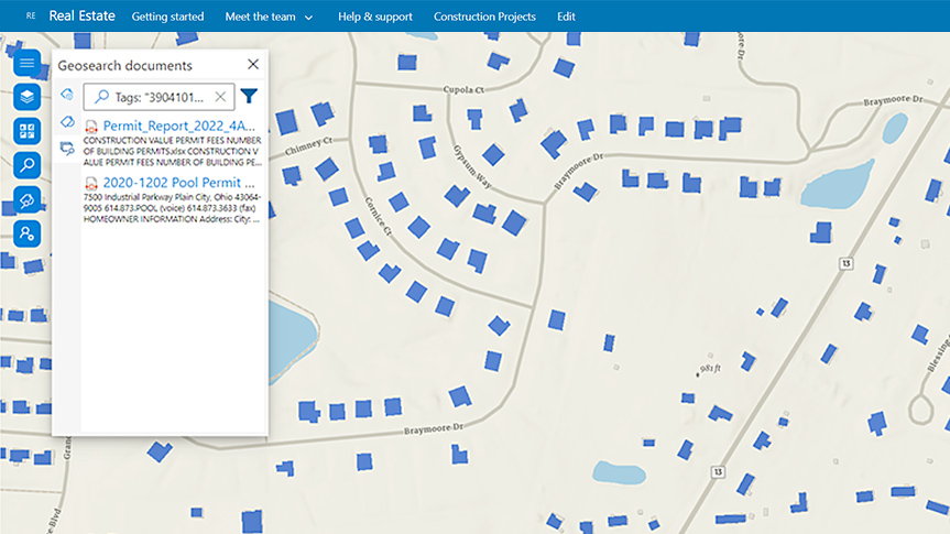 A Microsoft SharePoint interface displaying a map of a neighborhood with structures highlighted in blue and a search pane overlaid to the left