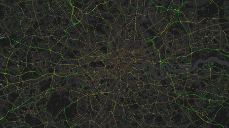 A map of the greater London area shows road networks highlighted in bright yellow against a dark background.