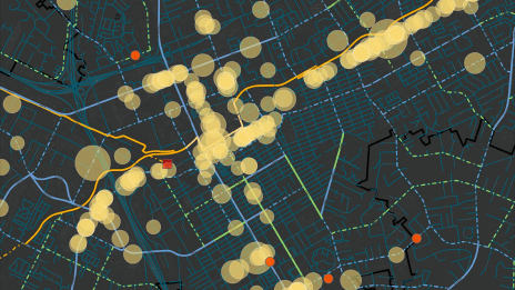 A map of an urban area shows data clusters in translucent yellow against a dark background.