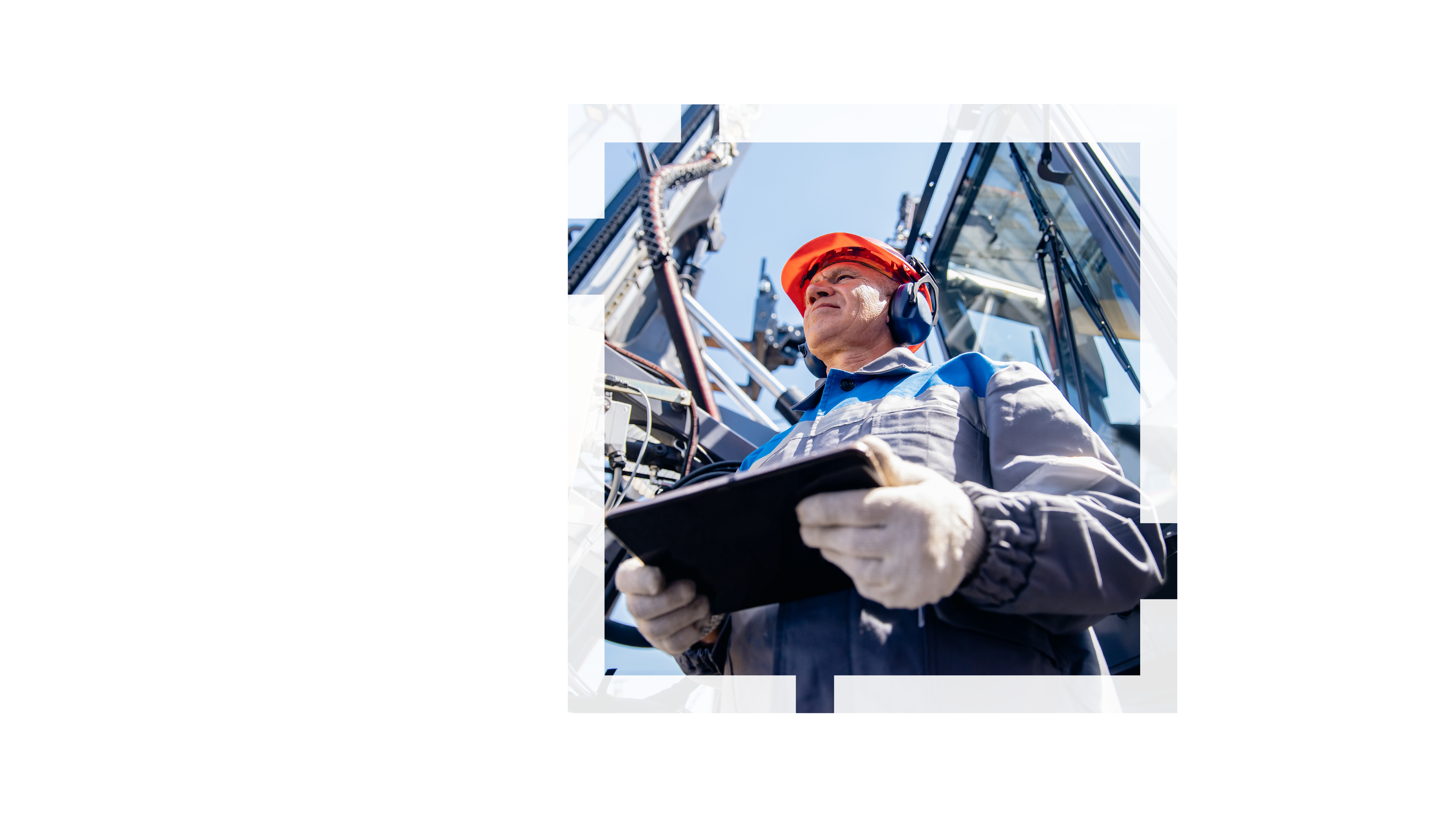 A person wearing an orange safety helmet and noise-cancelling headphones standing beside a large piece of site machinery holding a tablet, overlaid on another image with an aerial view of a storage facility with many colorful crates and trucks