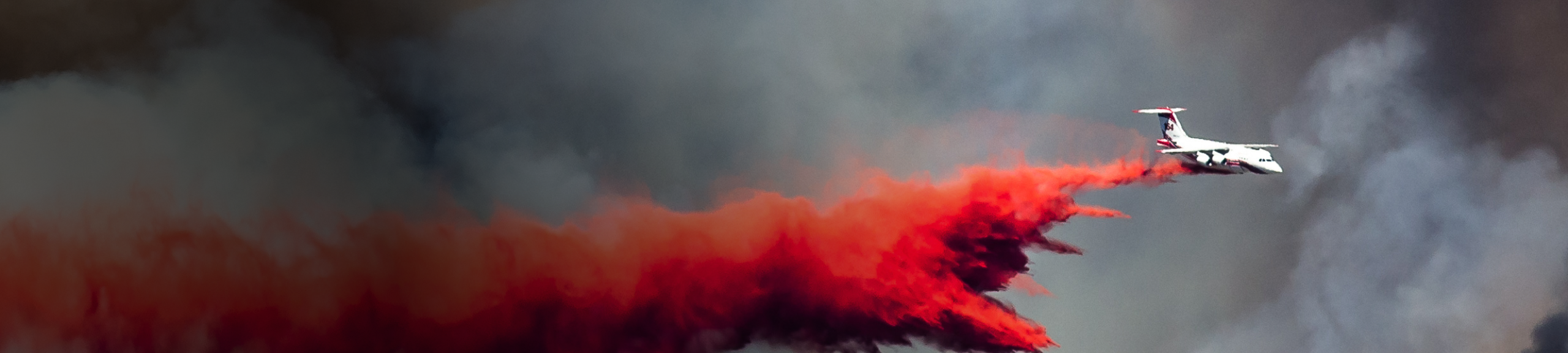 Aircraft Dropping Fire Retardant as it Battles the Raging Wildfire
