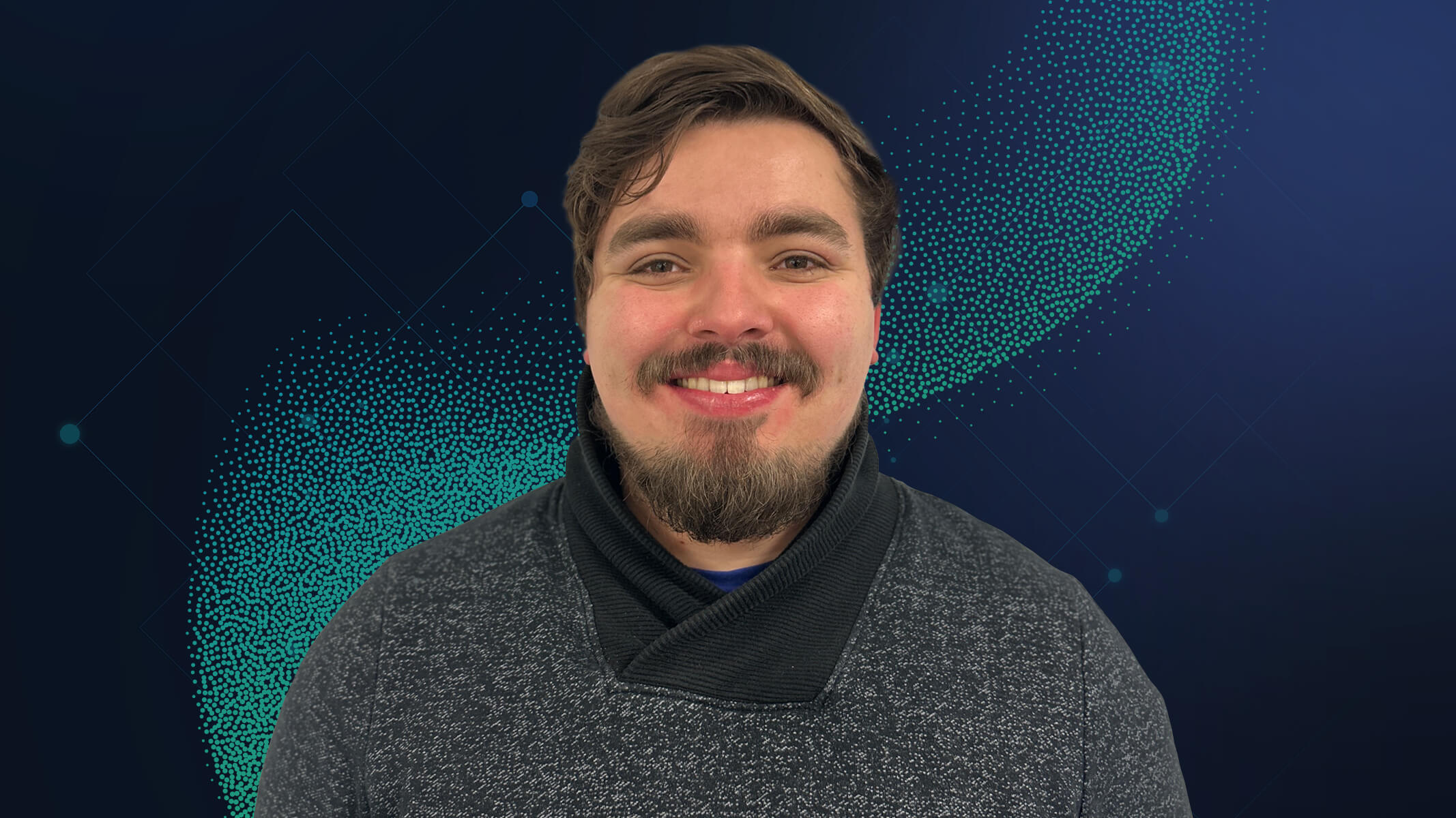 Portrait of Isaac Jones smiling in a gray sweater with an abstract green graphic background