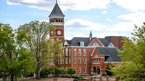 A view of a campus building at Clemson University surrounded by trees
