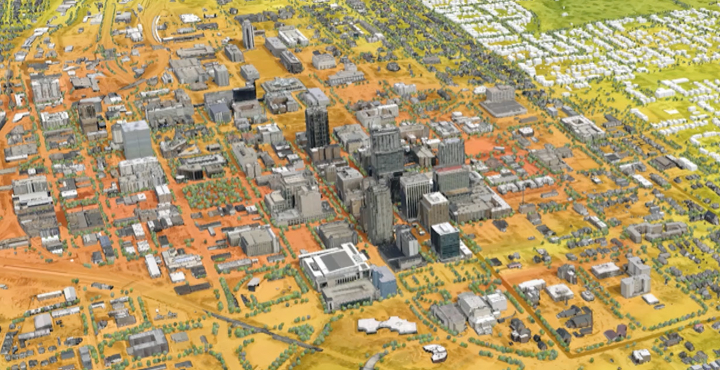 An aerial 3D image of a city in grays and yellows; click this image to play the video 