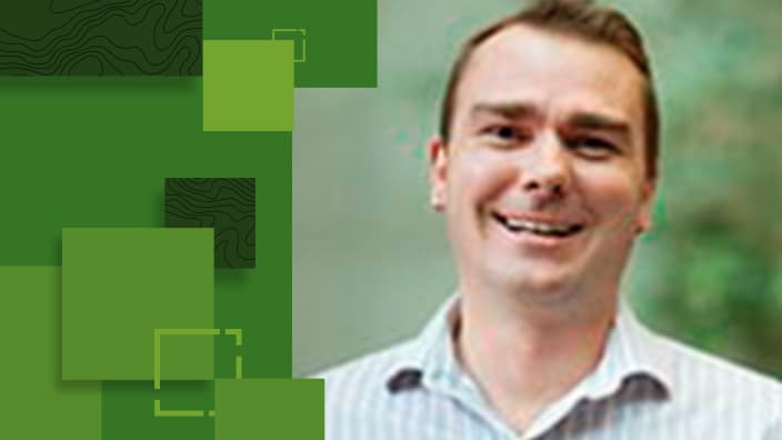A portrait of Ryan Perkl smiling overlaid with multiple green squares in varying sizes to the left of the image