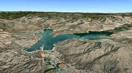 A 3D scene in ArcGIS Earth of a body of water in a mountain basin