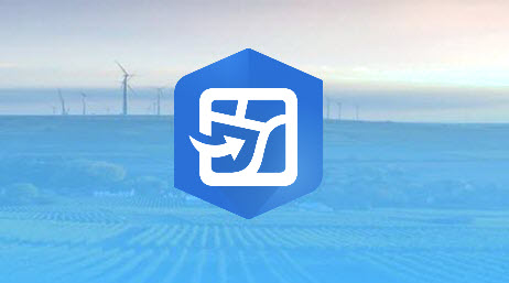 A wind farm in a large green field with an overlayed blue icon of a square map and an arrow