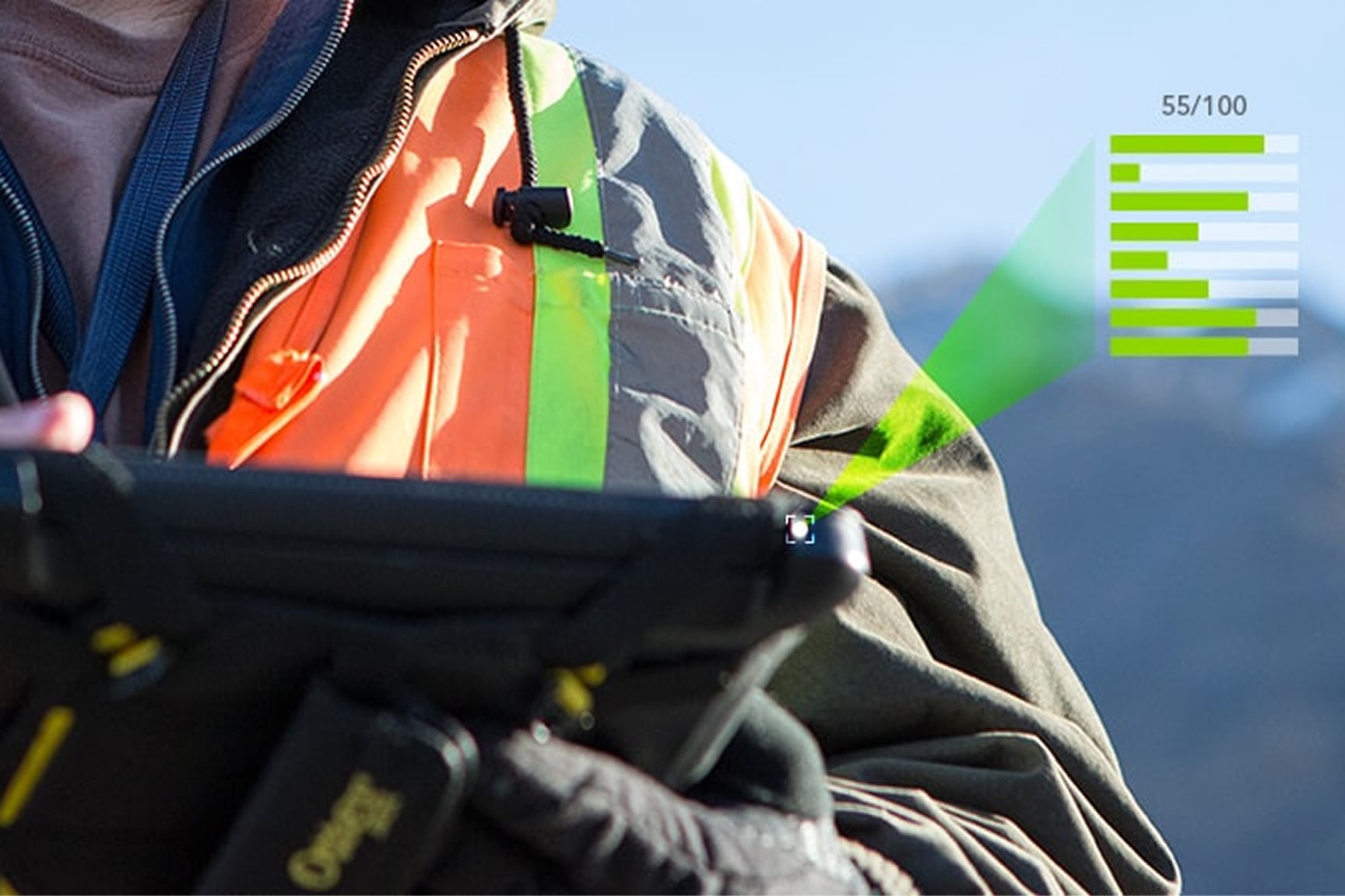 Mobile worker in a safety vest holds a tablet outdoors, using ArcGIS Survey123 for field data collection