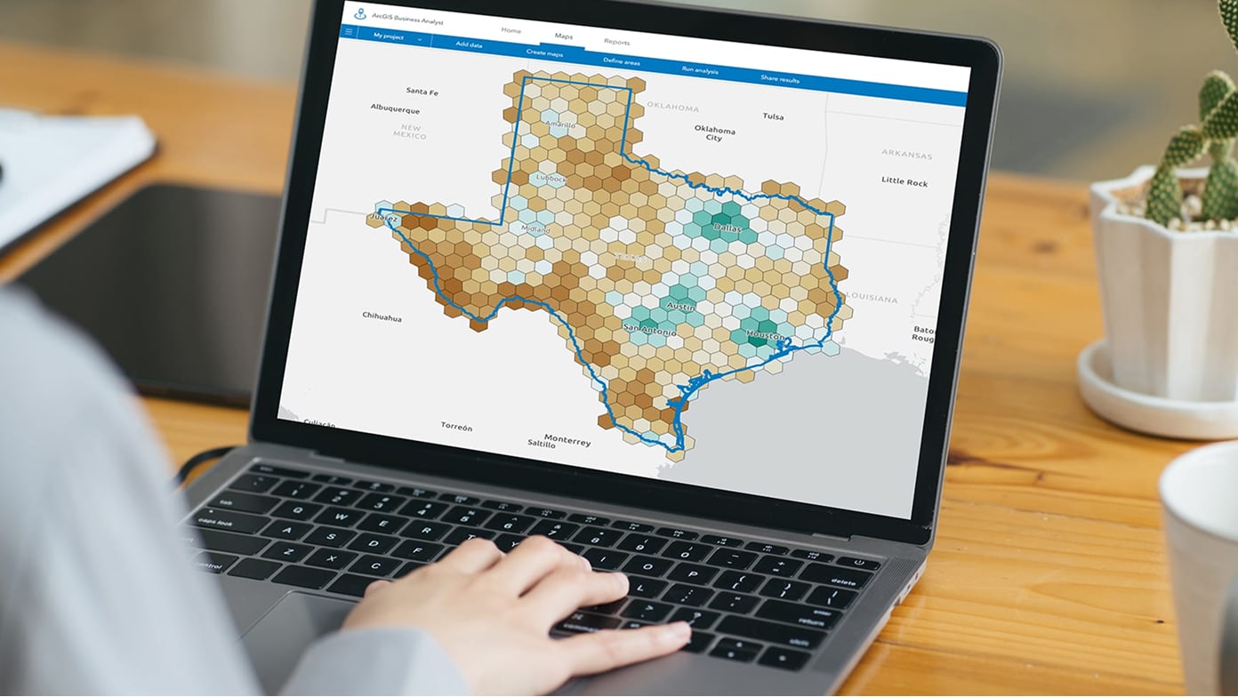 Laptop displaying an ArcGIS Business Analyst map used for location-based analysis and decision-making