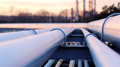 Cover image with a pipeline at sunset for the 2023 Webinar "Leveraging Esri GIS imagery workflows for pipeline”