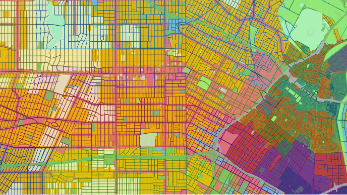 A vibrant, abstract map displays a city layout with a grid of streets and blocks.
