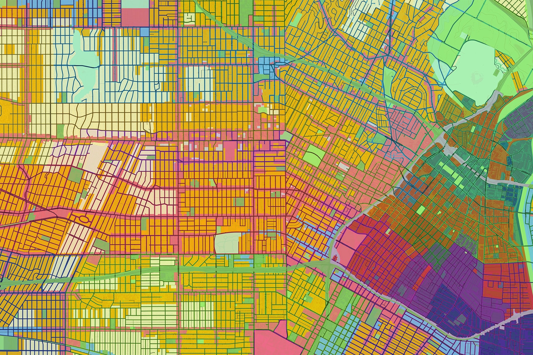 A vibrant, abstract map displays a city layout with a grid of streets and blocks.