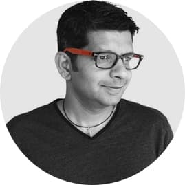 Black and white headshot of Sajit Thomas, UX architect