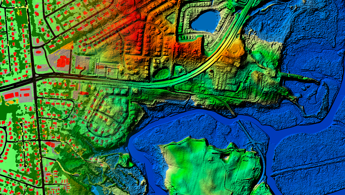 A 3D map of city and body of water, with low elevation areas in blue and higher elevation areas in red.