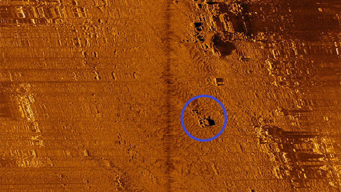 A sonar image of lost fishing gear identified with a blue circle along the ocean floor