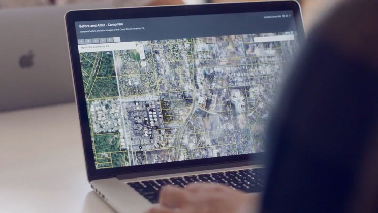 A laptop displaying a map created with ArcGIS technology that shows data about a local wildfire