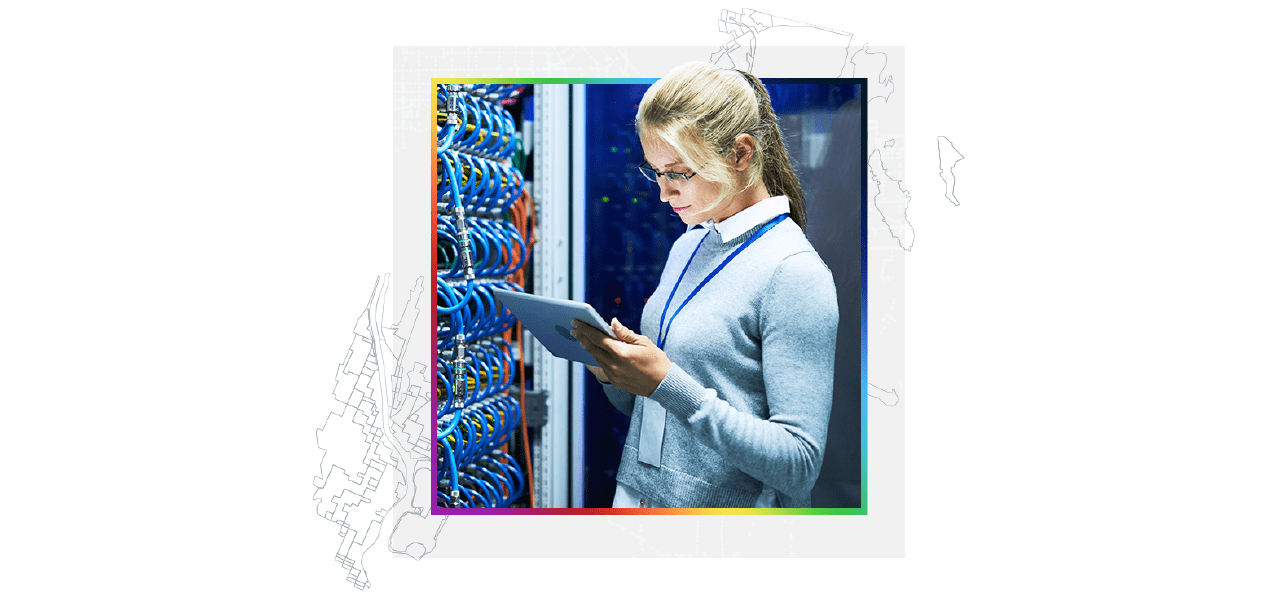 A cloud expert performing maintenance in a server room using an iPad