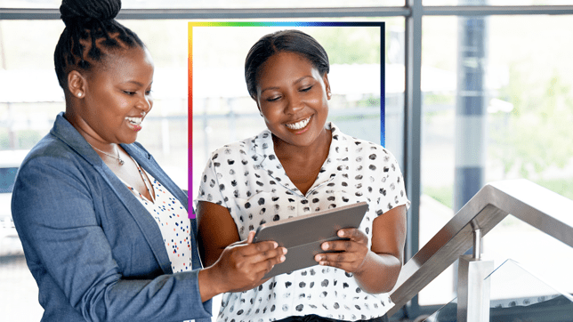 An adviser using a tablet to share resources with a client