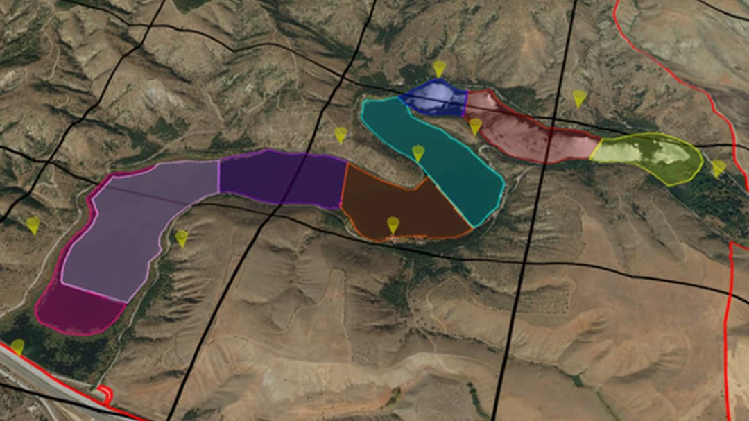 A detailed aerial view showcasing a segmented terrain map with color-coded zones.
