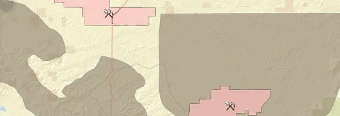 A geographic map highlighting mining zones marked with crossed pickaxe icons.
