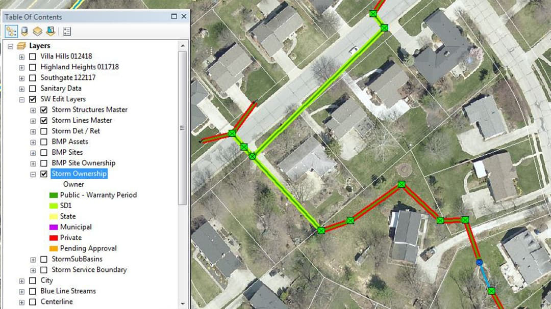 A detailed GIS map displaying storm ownership layers over a residential neighborhood.