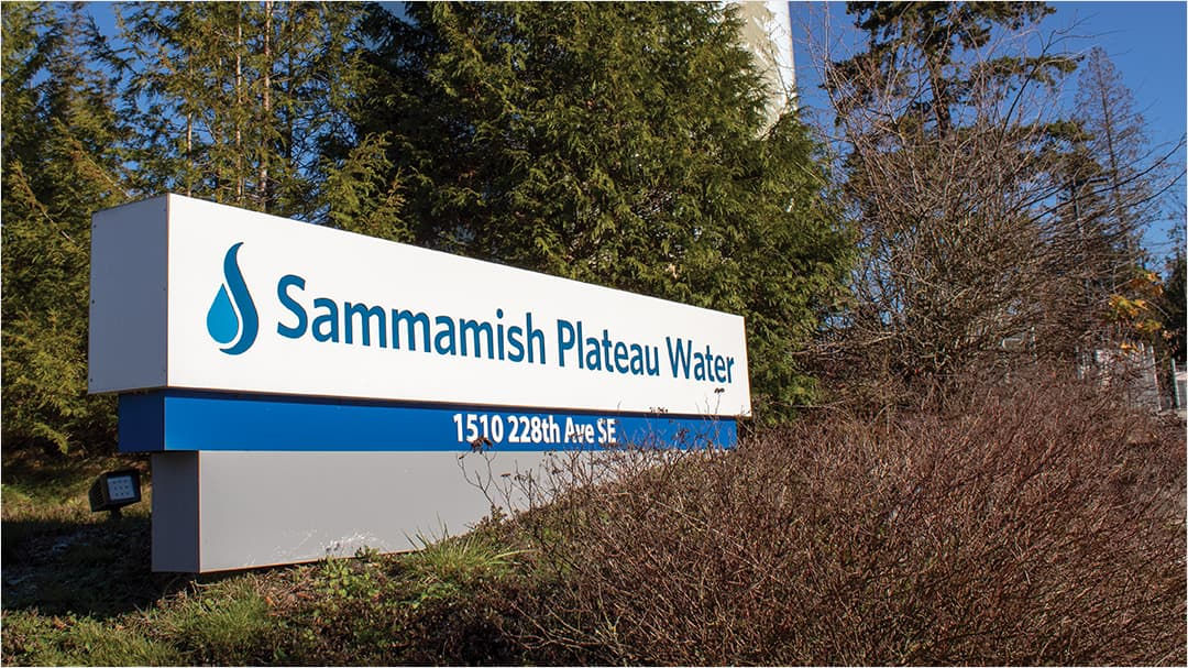 A large outdoor sign displays 'Sammamish Plateau Water' with a blue water droplet icon.
