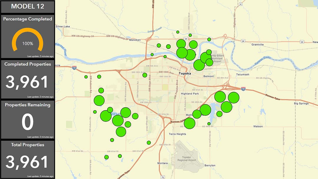 A detailed map showing completed properties in Topeka, Kansas, marked with green dots.