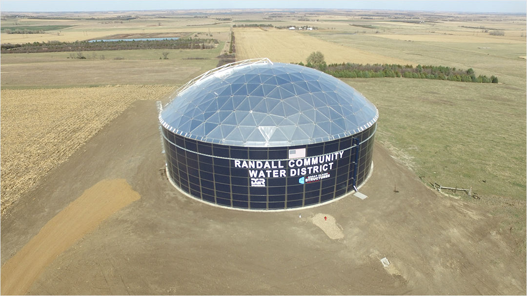 A large dome-shaped water storage facility labeled 'Randall Community Water District' is situated in a rural landscape. 