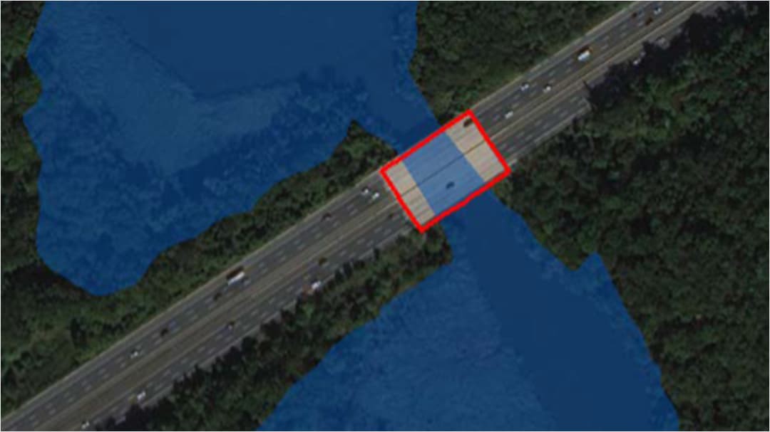 Satellite imagery of a bridge outlined in red to show vulnerability.  