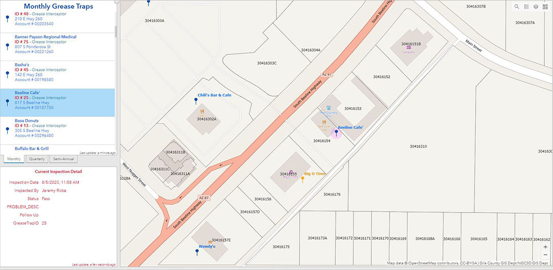 A detailed map showing grease trap inspection locations along a street.