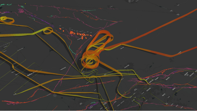 3D visualization of aircraft flight paths and their altitudes expressed in multi-dimensions with a series of red, green, and orange connected lines