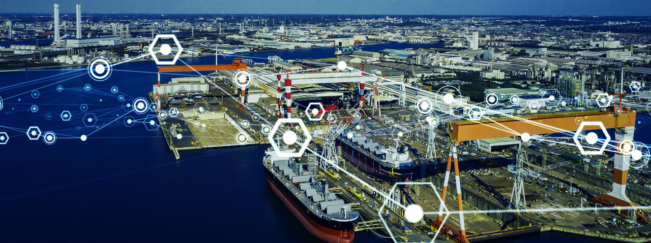 A loading dock at a coastal port overlaid with many interconnected white dots