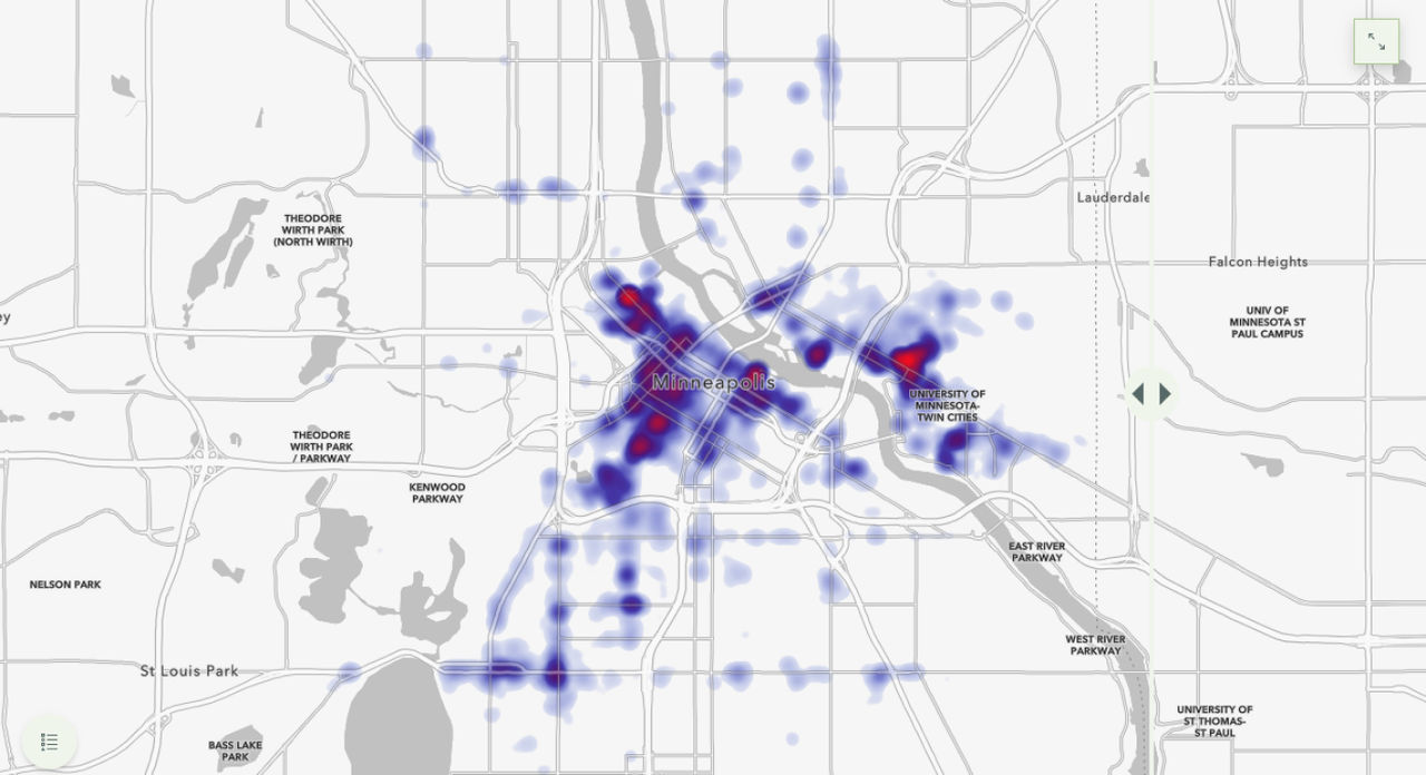 A rey base map of the city of Minneapolis with purple and orange heat clusters spread throughout