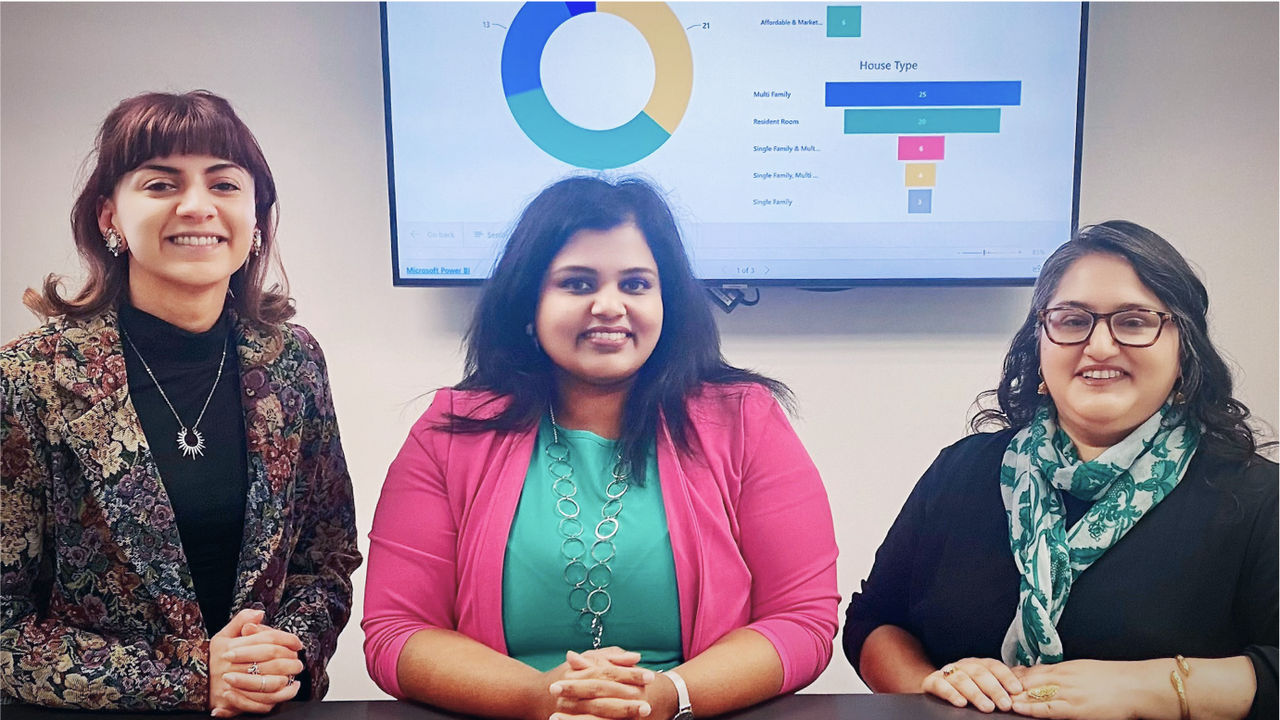 The Office of GIS Services team during a presentation of the Housing Navigator Website: Stephanie Ladas, Aarthy Sabesan, and Naghma Malik.