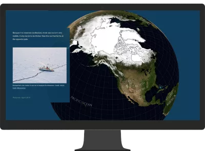 A monitor displaying an illustration of Earth with a large area in white representing a story of sea ice and ocean warming