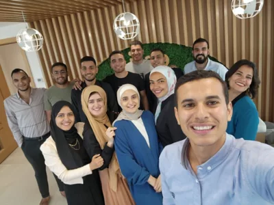 A tablet next to a smart phone and both have the same street map on them