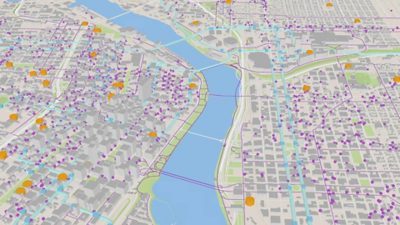 Carte 3D de l’infrastructure d’une ville avec des nœuds orange et violets affichant les points d’intérêt et leurs connexions
