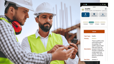 Two field workers in safety vests reviewing a mobile device together, with a digital map and task interface displayed beside them