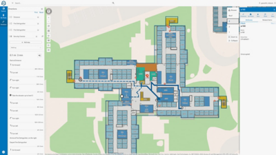 Indoor mapping software showing a building floor plan with blue walking routes and turn-by-turn directions.