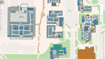 색상으로 구분된 건물 평면도가 표시되고, 인터랙티브 내비게이션 컨트롤이 포함된 디지털 2D 맵