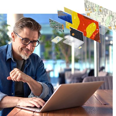 Kuvituskuva, missä mies tarkastelee läppäriltä verkkotietojärjestelmästä tietoja