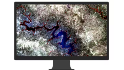 A computer monitor displaying an ArcGIS StoryMaps story with a block of text beside a photo of an oceanographer posing by the ocean