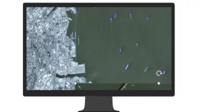 A computer monitor displays a comprehensive map illustrating a large network's structure and connections.