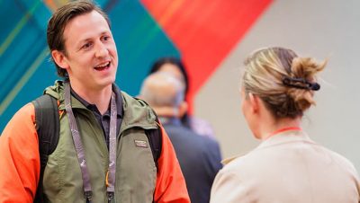 An Esri partner and staff member engaged in conversation